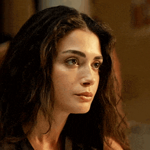 a close up of a woman 's face with a very serious look on her face