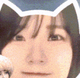 a close up of a person 's face with cat ears