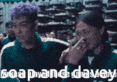 a man with purple hair is standing next to another man with black hair and the words soap and davey