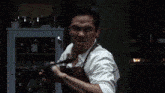 a blurry image of a man holding a knife