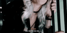 a woman with gray hair is talking on a cell phone .