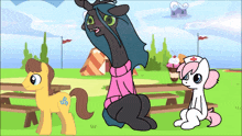 a cartoon of three ponies with one wearing a pink sweater with a cross on it