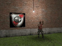 a man is standing in front of a brick wall with a grp poster on it