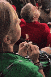 a person wearing a green shirt that says part of