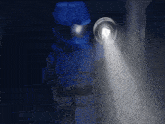 a blue lego figure is holding a flashlight in a dark room