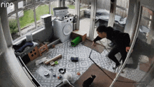 a ring camera shows a man walking through a cluttered room