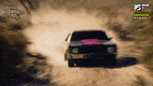 a car is driving down a dirt road in grand theft auto v