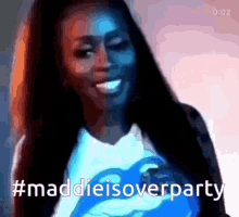 a woman wearing a blue shirt that says maddie is overparty