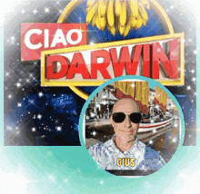 a man wearing sunglasses stands in front of a ciao darwin sign