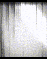 a pixelated image of a white curtain with a window behind it
