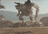 a large robot is flying through the air in a field
