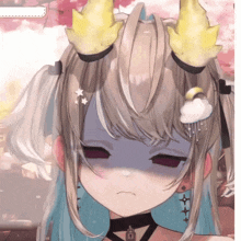 a close up of a girl 's face with her eyes closed and yellow horns
