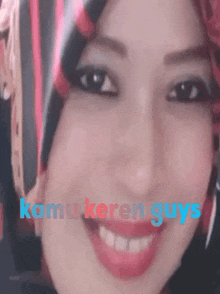 a close up of a woman 's face with the words kamu keren guys written on the bottom