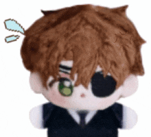 a stuffed toy of a boy with a green eye .