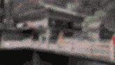a blurry picture of a building with a sign that says ' a & a ' on it