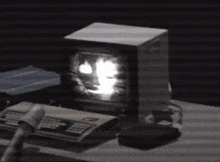 a computer monitor with the letter x on the screen