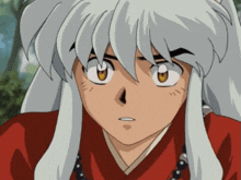 a close up of a person 's face with a red shirt and white hair