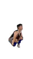 a man wearing shorts and a tank top that says asics on it