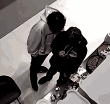 a man wearing a black hoodie that says coal