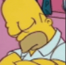 a close up of homer simpson 's face with his mouth open .