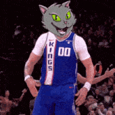 a basketball player wearing a kings jersey with a cat head