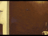 a person is standing in front of a wooden door in a room