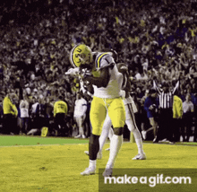 a football player wearing a helmet that says lsu