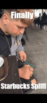 a boy sitting at a table with a pencil in his hand and the words finally starbucks splint