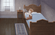 a boy sitting on a bed holding a fan