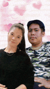 a man and a woman are posing for a picture together