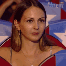 a woman is sitting in front of a screen that says got talent