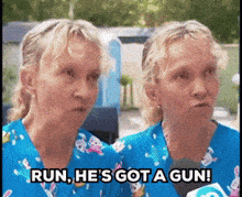 two women in blue scrubs are saying run he 's got a gun ..