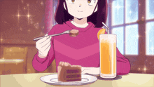 a girl is sitting at a table eating a piece of cake
