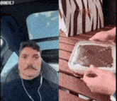 a man with a mustache is sitting in a car next to a container of chocolate cake