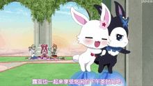 a couple of rabbits are standing next to each other with chinese writing on the bottom