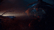 a blurred image of a dark room with a blue light in the middle