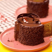 a slice of chocolate cake is being taken out of it