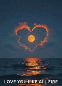 a picture of a full moon with a heart made of clouds over the ocean