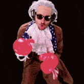 a man in a costume is wearing boxing gloves and headphones