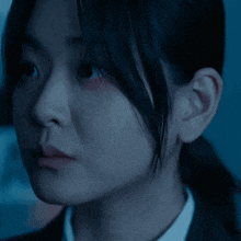 a woman with a purple spot on her forehead