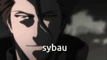 a close up of a man 's face with sybau written in white