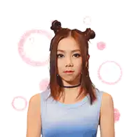 a woman with two buns on her head is making a heart with her hands