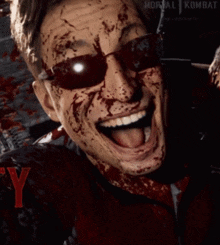 a man with blood on his face is wearing sunglasses and a jacket that says mortal kombat