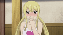 a blonde anime girl with pigtails and a pink heart on her shirt