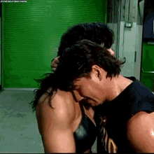 Eddie Guerrero Chyna GIF - Eddie Guerrero Chyna Fake Hug GIFs