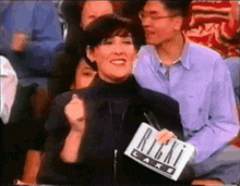 a woman holding a sign that says right cake on it