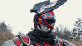 a close up of a robot with a gun on his head .