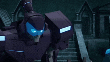 a purple robot with blue eyes is standing in front of stairs