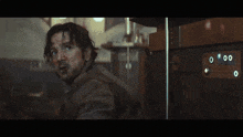 a man holding a gun with a scope on it