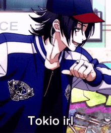 a man in a baseball cap is pointing at the camera and the words tokio irl are below him